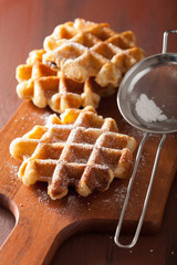 belgian waffles sprinkled with icing sugar