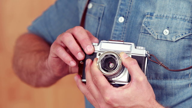 Hipster using his vintage camera