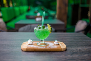 lemonade with lime, mint on a wooden table

