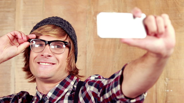 Hipster taking a selfie with phone