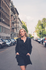 Beautiful girl posing in the city streets