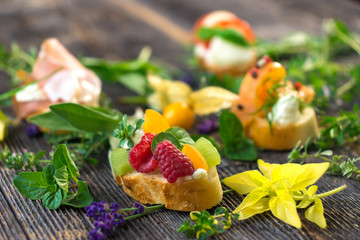 Delicious tapas on a wooden background
