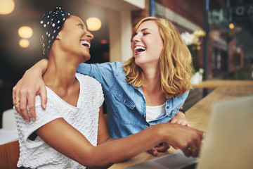 Two affectionate multiracial women friends