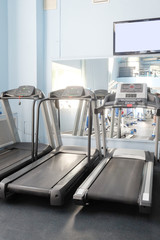 Interior of a fitness hall with treadmill