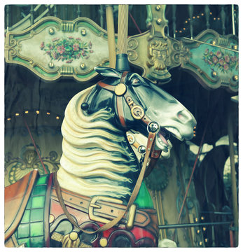 Horse in a carousel. Cross processed to look likean aged picture