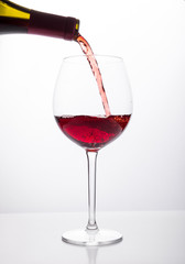 Red wine being poured into glass 