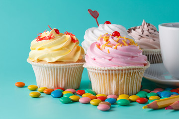 Lot of colorful cupcakes. Closeup view