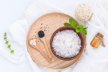 Raw coconut and coconut essential oils  with sea salt and herbs