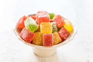 Fruit jelly bonbons in the bowl,selective focus