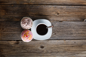 Colored cupcake on rustic background