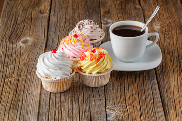 Colored cupcake on rustic background