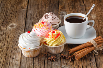 Colored cupcake on rustic background
