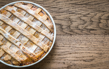 Pumpkin pie on the wooden background