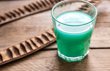 Glass of blue curacao and juice cocktail