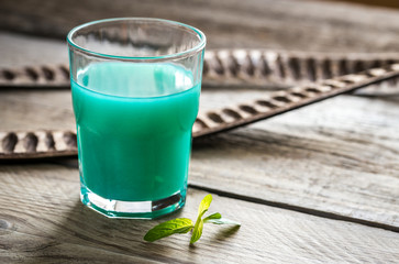 Glass of blue curacao and juice cocktail