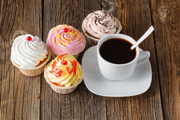 Colored cupcake on rustic background