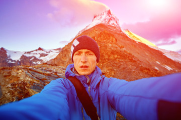 hiker at the top of a pass