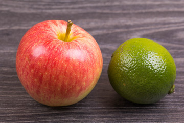 Apple and lime on a table