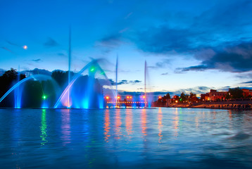 Beautiful fountain at night illuminated with blue light. Vinnyts