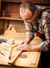 Close up of carpenter restoring old furniture