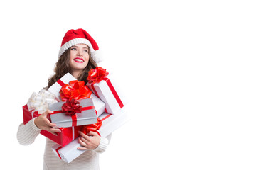 Beautiful woman in santa hat and white sweater isolated.