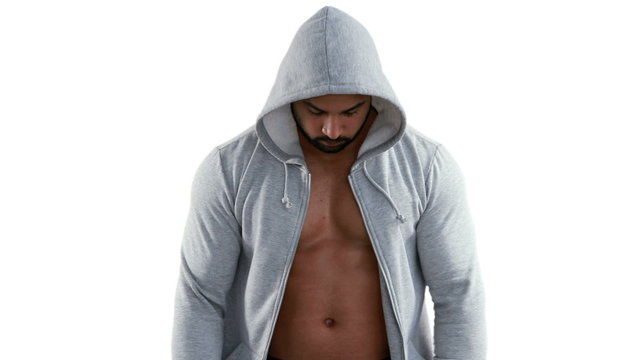 Muscular man wearing grey hood 