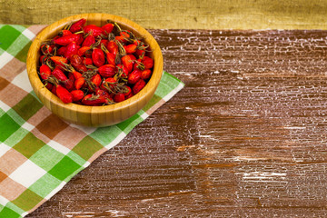 Dogrose in a plate on a table