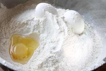 Still life. Flour with an egg in a bowl
