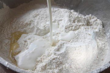 Still life. Flour with an eggs and milk in a bowl