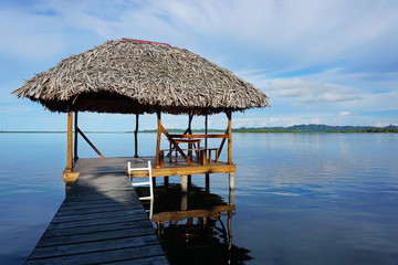 Tropical hut palapa over the water