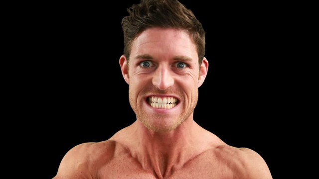 Bodybuilder flexing for the camera