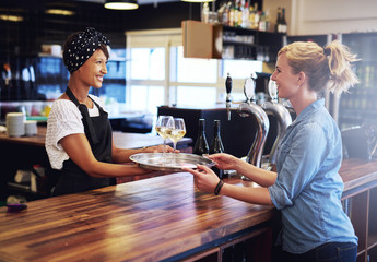 Waitress Giving Glasses of Wines to Customer