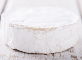 Brie cheese on white background.selective focus.