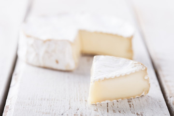 Fototapeta na wymiar Brie cheese on white background.selective focus.
