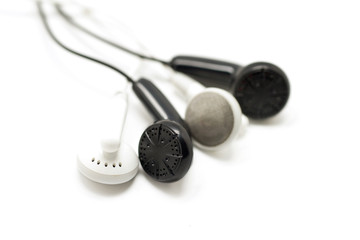 black and white earbuds isolated on white