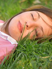 Woman sleeping on the grass