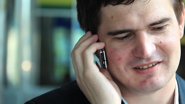 Man speaks on a mobile phone