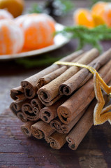 Winter Christmas decorations, tangerines and cinnamon