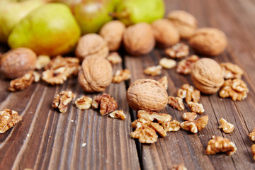 Apples and nuts on a wooden table