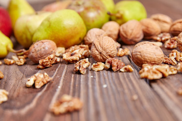 Apples and nuts on a wooden table