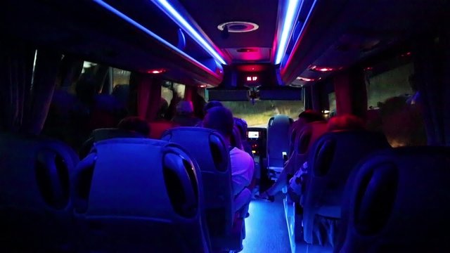 People inside salon of minibus