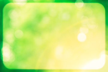 Green and yellow glitter sparkle defocused rays lights bokeh wit