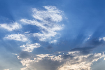 light of sunbeam on blue sky background with clouds and sun light