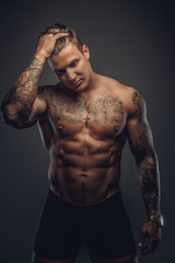 Fototapeta premium Strong shirtless tattooed man.