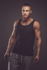 Fototapeta premium Athletic bearded man in black t shirt.