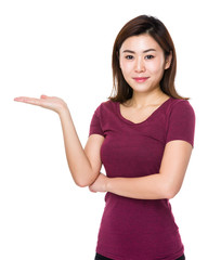 Asian young woman with hand showing blank sign