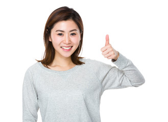 Young woman showing thumb up