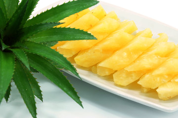 Pineapple slices in a white background.