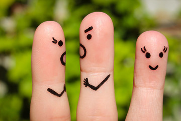 Finger art of family during quarrel. A couple arguing, another woman is happy. 