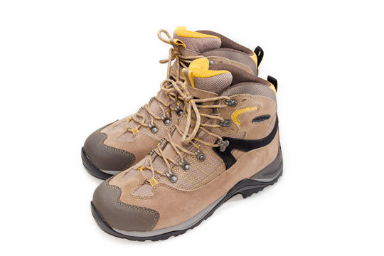 Light brown trekking shoes on a light background